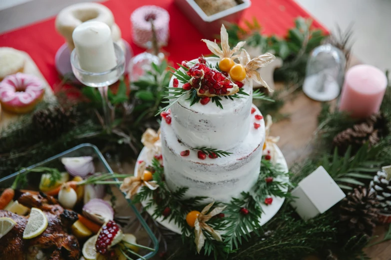 a wedding cake sitting on top of a wooden table, by Julia Pishtar, pexels contest winner, wearing festive clothing, ingredients on the table, healthy, crimson and white color scheme