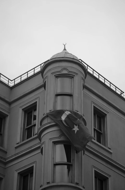 a black and white photo of a building, by Niyazi Selimoglu, flickr, flag, ottoman empire, wellington, star roof