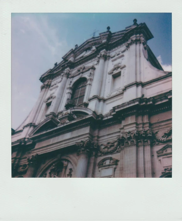 a large building with a clock on top of it, a polaroid photo, inspired by Károly Markó the Elder, unsplash, neoclassicism, cathedral!!!!!, front side, holy place, lo-fi