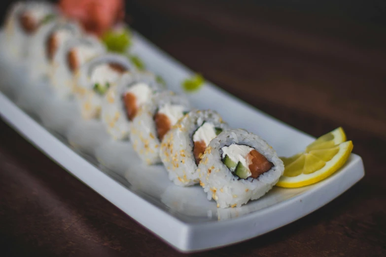 a close up of a plate of food on a table, inspired by Maki Haku, unsplash, mingei, sassy pose, creamy, stuffed, 6 pack