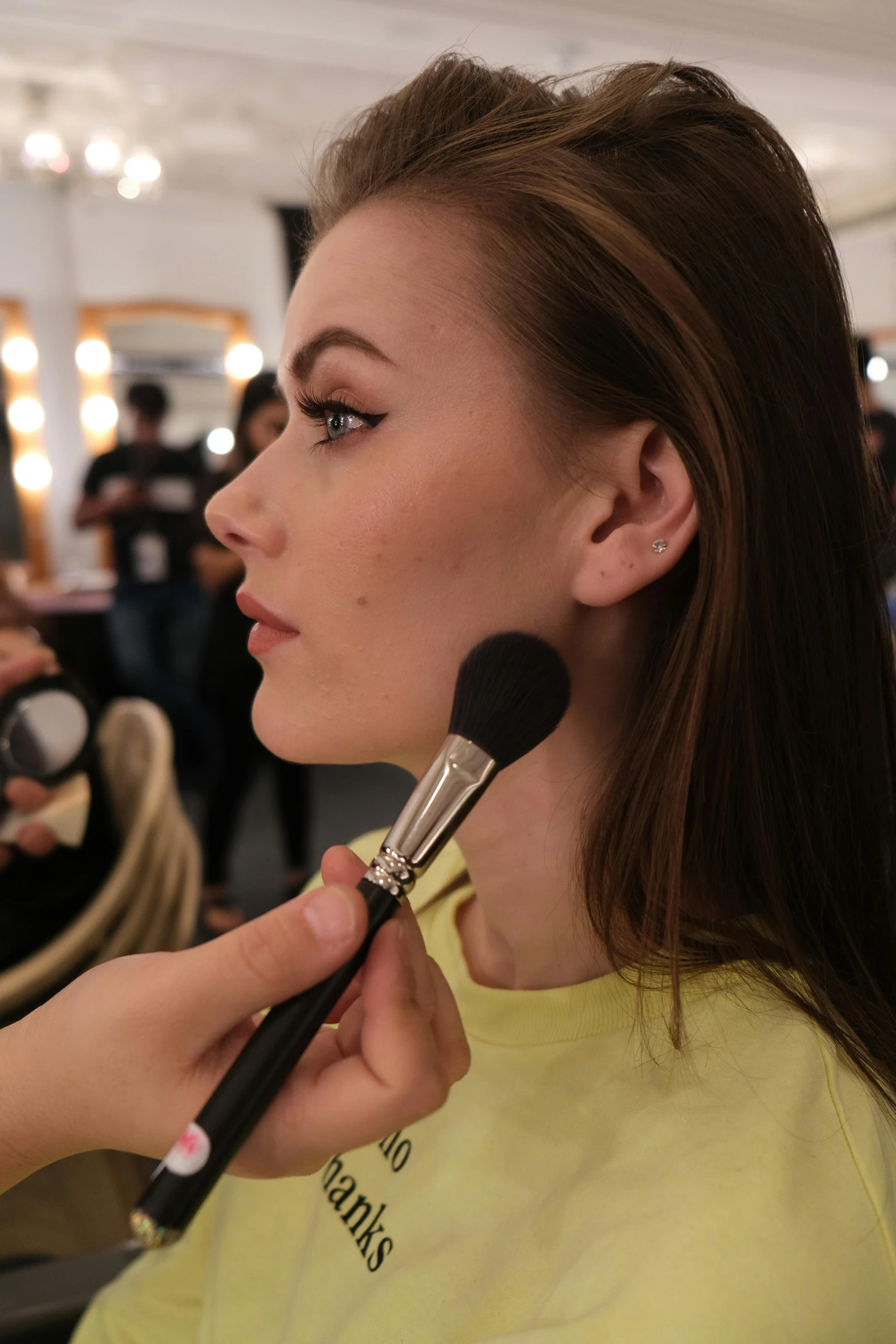 a woman is getting her make up done, by Robbie Trevino, sephora, photo of a model, anastasia ovchinnikova, medium height