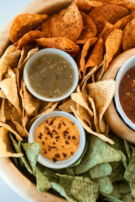 a wooden bowl filled with chips and dips, by Carey Morris, pexels, dau-al-set, square, salsa tricks, background image, tacos