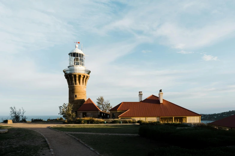 a light house sitting on top of a lush green hillside, manly, observation deck, lit from below, julia sarda