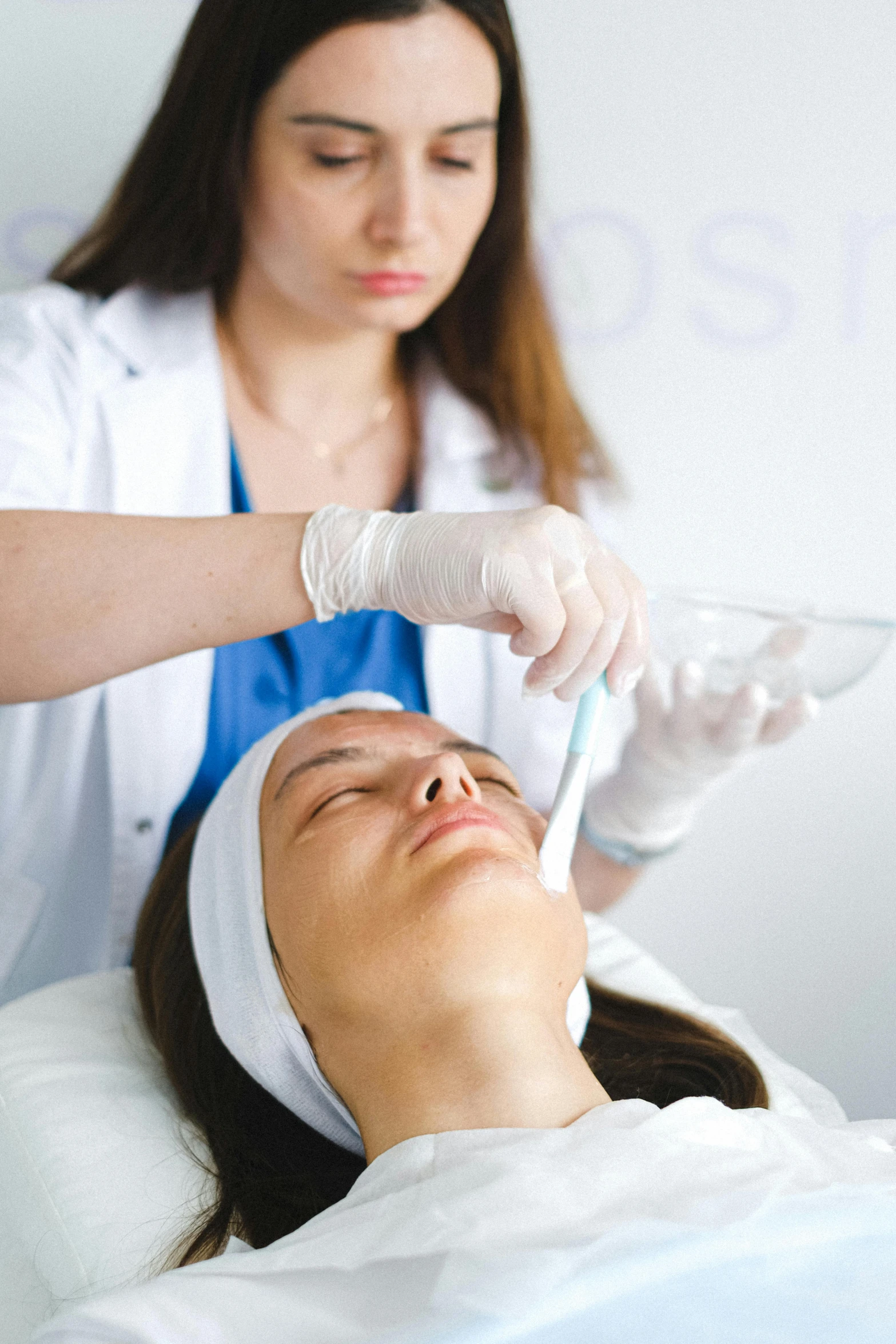 a woman getting an injection from a doctor, a photo, by Adam Marczyński, shutterstock, renaissance, her face is coated in a white, color degragation, square, ilustration