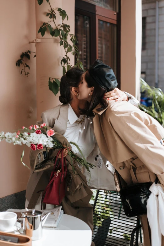 a couple of people that are kissing each other, trending on pexels, carrying flowers, wearing a trenchcoat, lesbian, 🎀 🧟 🍓 🧚