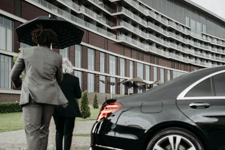 a couple of people that are walking with an umbrella, mercedez benz, luxurious environment, cinematic render, hotel