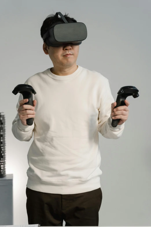 a man holding two video game controllers in his hands, a hologram, inspired by Cheng Zhengkui, reddit, realism, oculus quest 2, raytracing : :, he wears dark visors, thicc build