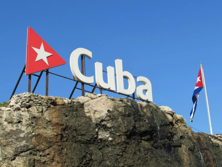 a sign that says cuba on top of a rock, a photo, flags, square, 15081959 21121991 01012000 4k, peak experience ”