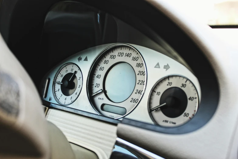 a close up of a dashboard of a car, unsplash, les automatistes, taken in the 2000s, mercedez benz, “hyper realistic, gauges