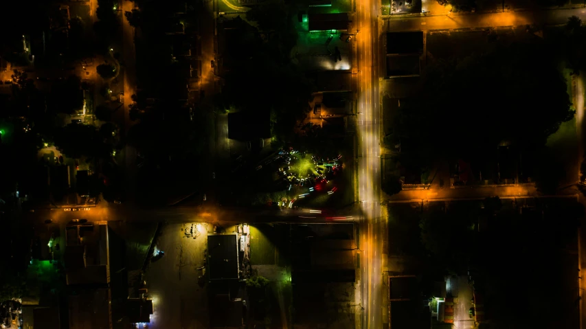 an aerial view of a city at night, a portrait, by Adam Marczyński, pexels contest winner, realism, streetlight, in an american suburb, slightly pixelated, top down perspecrive