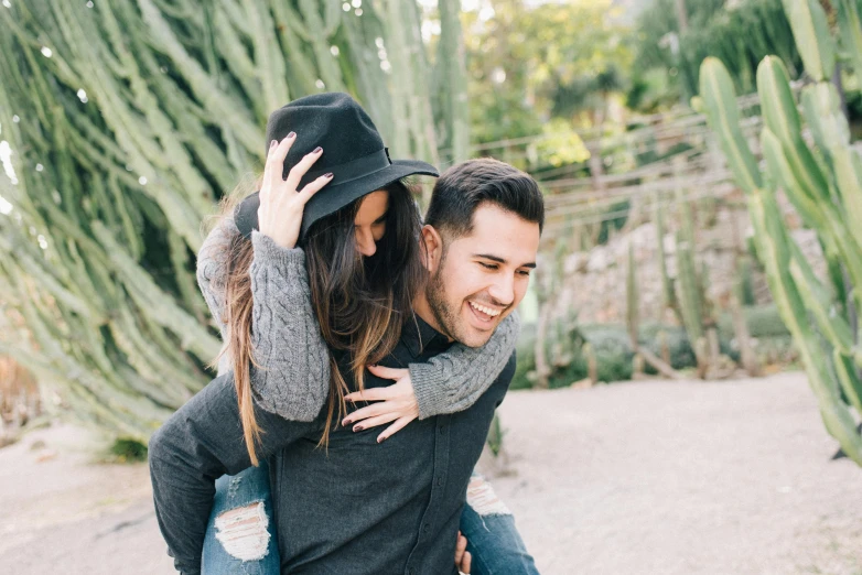 a man riding on the back of a woman, pexels contest winner, botanic garden, flirting smiling, avatar image, spiky