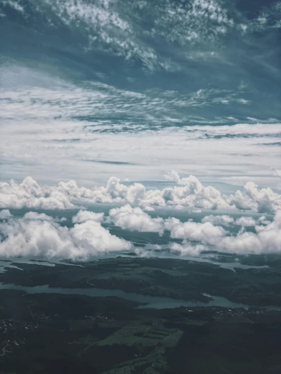 a view of the sky and clouds from an airplane, by Christen Dalsgaard, pexels contest winner, surrealism, bird\'s eye view, unsplash 4k, extremely high details, slight overcast