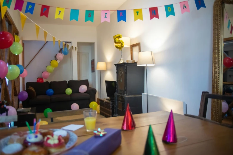 a birthday party is set up in a living room, unsplash, photography of kurzgesagt, colour photograph, banners, 5 years old