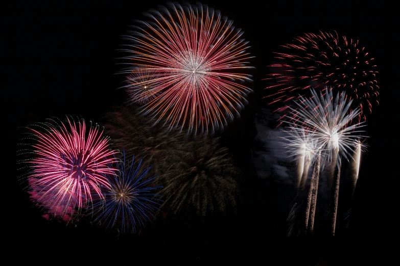 a group of fireworks in the night sky, a portrait, pexels, getty images, thumbnail, middle close up shot, coloured