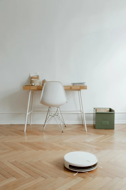 a room with a wooden floor and white walls, inspired by Peter de Sève, unsplash, desk, military storage crate, morandi color scheme, 15081959 21121991 01012000 4k