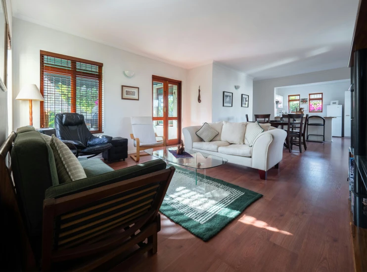 a living room filled with furniture and a flat screen tv, by Terese Nielsen, unsplash, light and space, ecovillage, sunny bay window, manuka, health spa and meditation center