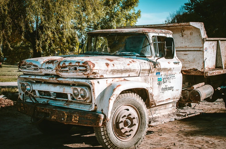 an old truck that is sitting in the dirt, unsplash, photorealism, chile, 💋 💄 👠 👗, hydrogen fuel cell vehicle, patina