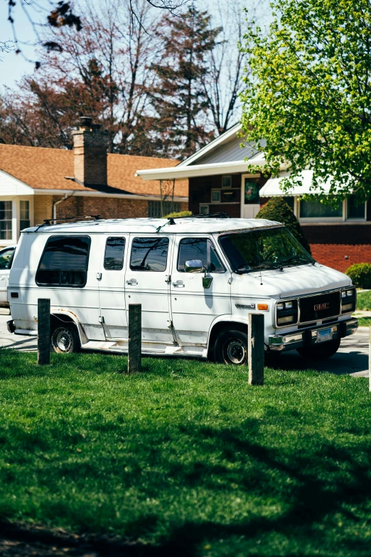 a white van parked in front of a house, by Tony Szczudlo, unsplash, renaissance, extreme shitty car mods, from wheaton illinois, 1997, lawns