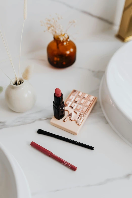 a bath room with a sink and a mirror, a picture, by Nicolette Macnamara, trending on pexels, lipstick, rubber stamp, tabletop model, brown