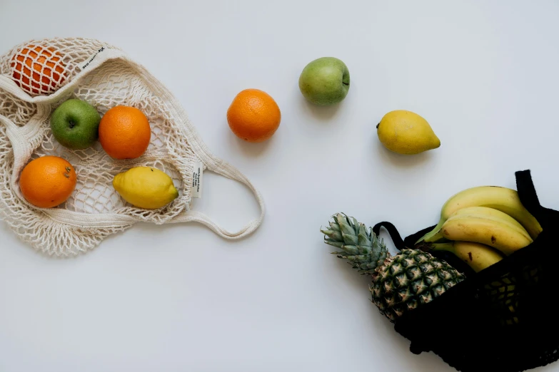 a bag of fruit sitting on top of a table, pexels contest winner, white backround, background image, various posed, thumbnail