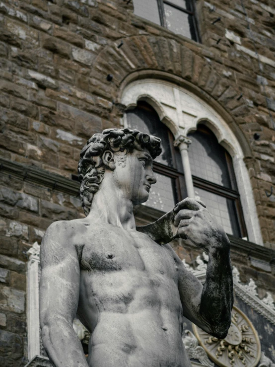 a statue of a man smoking a cigarette, a statue, inspired by Michelangelo Buonarotti, pexels contest winner, mid-shot of a hunky, florentine school, gray anthropomorphic, bargello