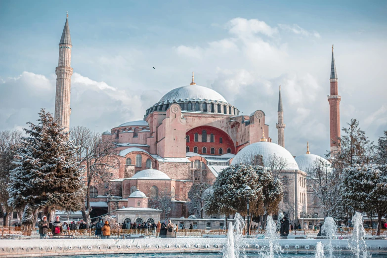 a large building with a fountain in front of it, a colorized photo, pexels contest winner, hurufiyya, covered with snow, byzantine, 🚿🗝📝