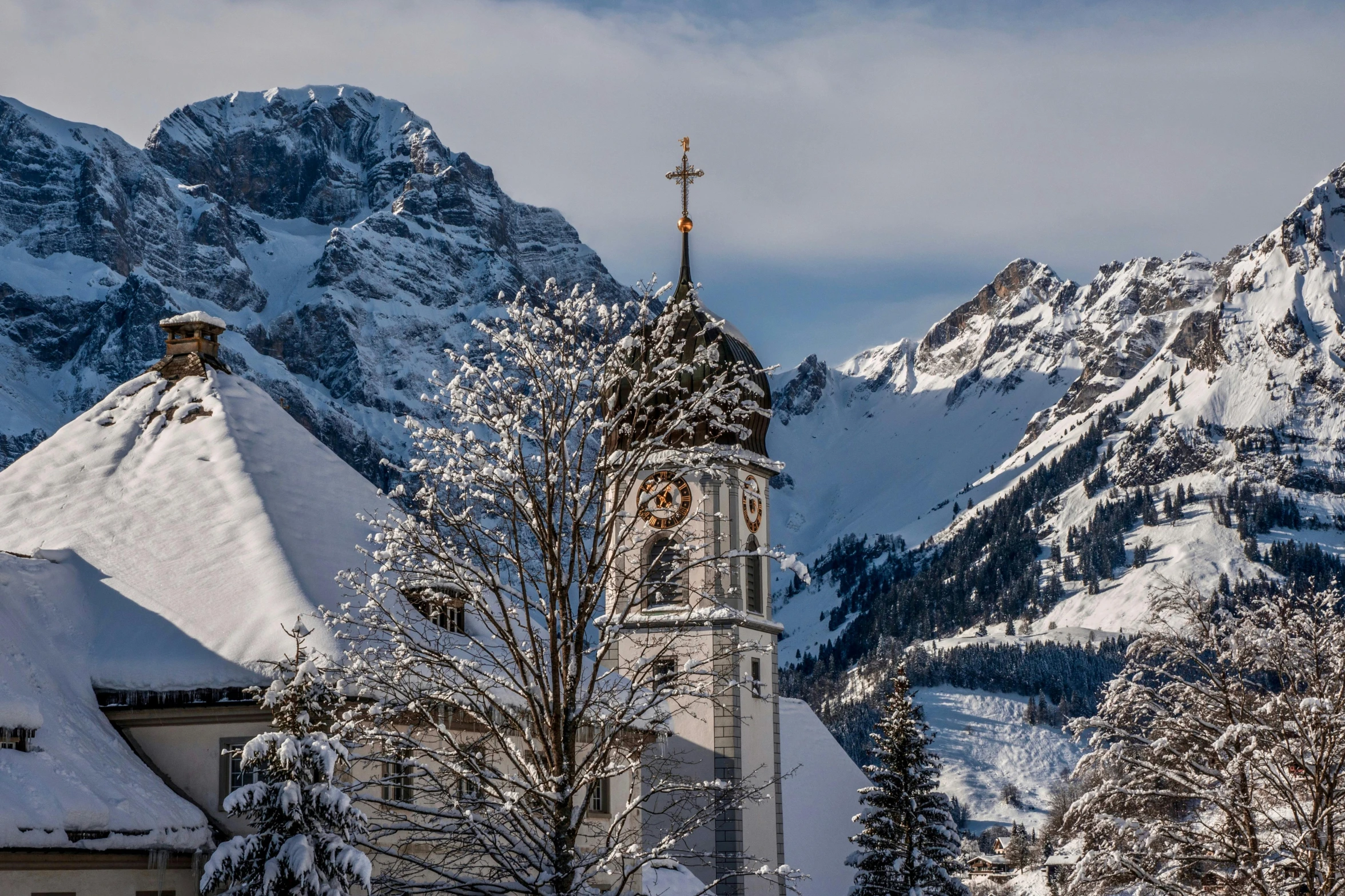 a church in the mountains covered in snow, pexels contest winner, art nouveau, clock tower, avatar image, high resolution photo