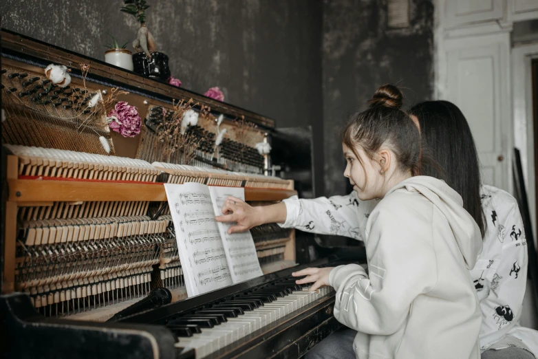 a little girl that is playing a piano, an album cover, pexels contest winner, school class, an abandoned, 15081959 21121991 01012000 4k, sydney hanson
