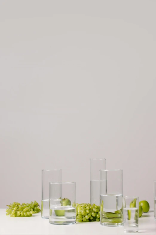 a bunch of glasses sitting on top of a table, by Harvey Quaytman, but minimalist, vials, studio product shot, small