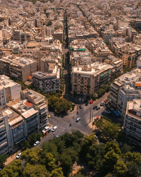 a large city filled with lots of tall buildings, by Alexis Grimou, pexels contest winner, neoclassicism, athene, lgbtq, drone footage, square