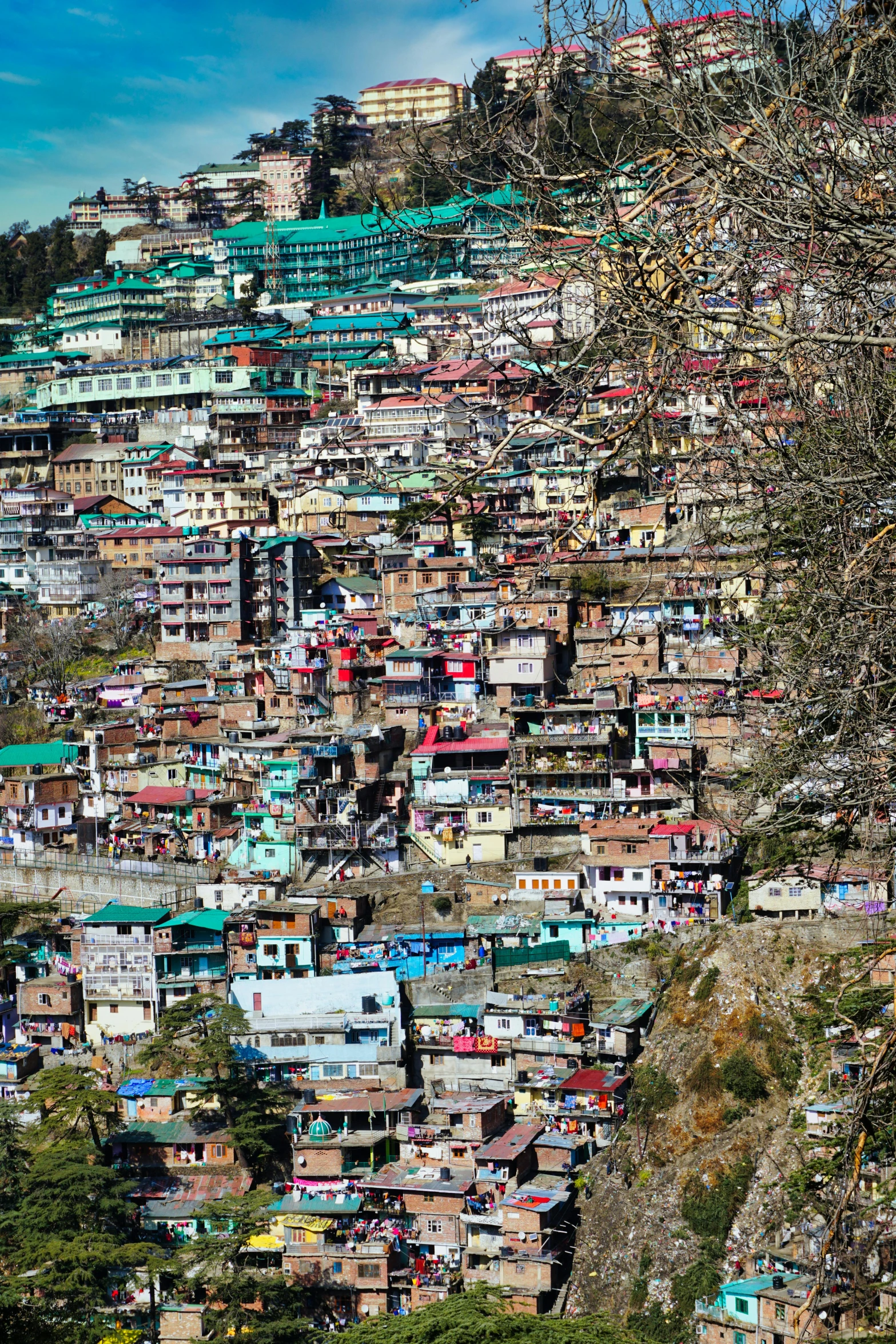 a hill that has a lot of houses on it, an album cover, pexels, happening, uttarakhand, full frame image, square, dos