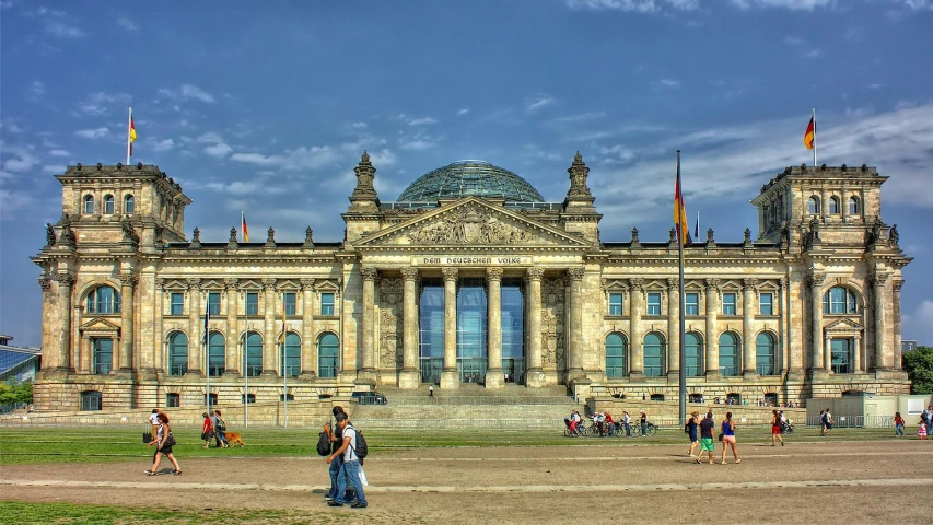 a group of people standing in front of a large building, pexels contest winner, berlin secession, parliament, 🚿🗝📝, profile image, german chancellor