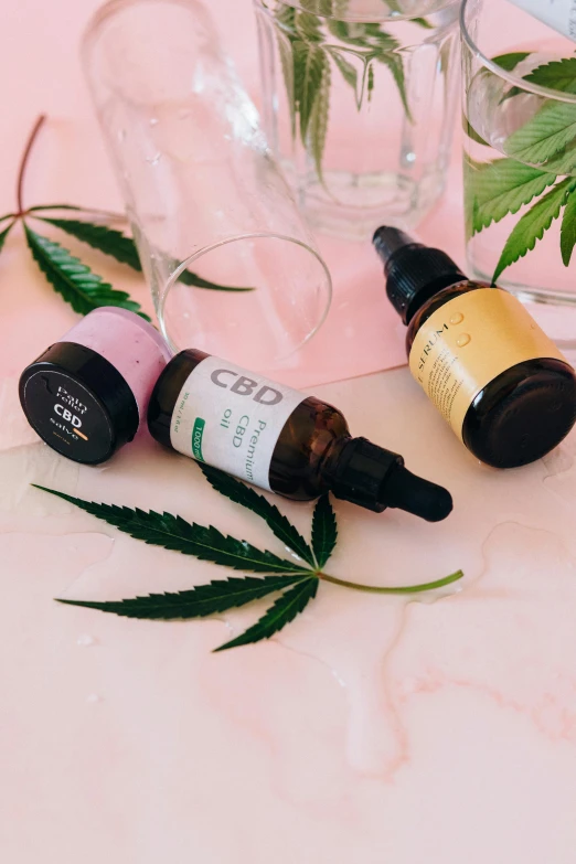 a bottle of cbd oil next to two bottles of cbd oil, a picture, by Julia Pishtar, trending on pexels, product display photograph, lesbians, high angle, panoramic shot