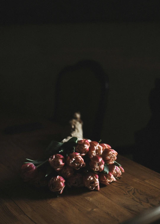 a bunch of flowers sitting on top of a wooden table, a still life, unsplash, romanticism, digital image, somber, tulip, full frame image