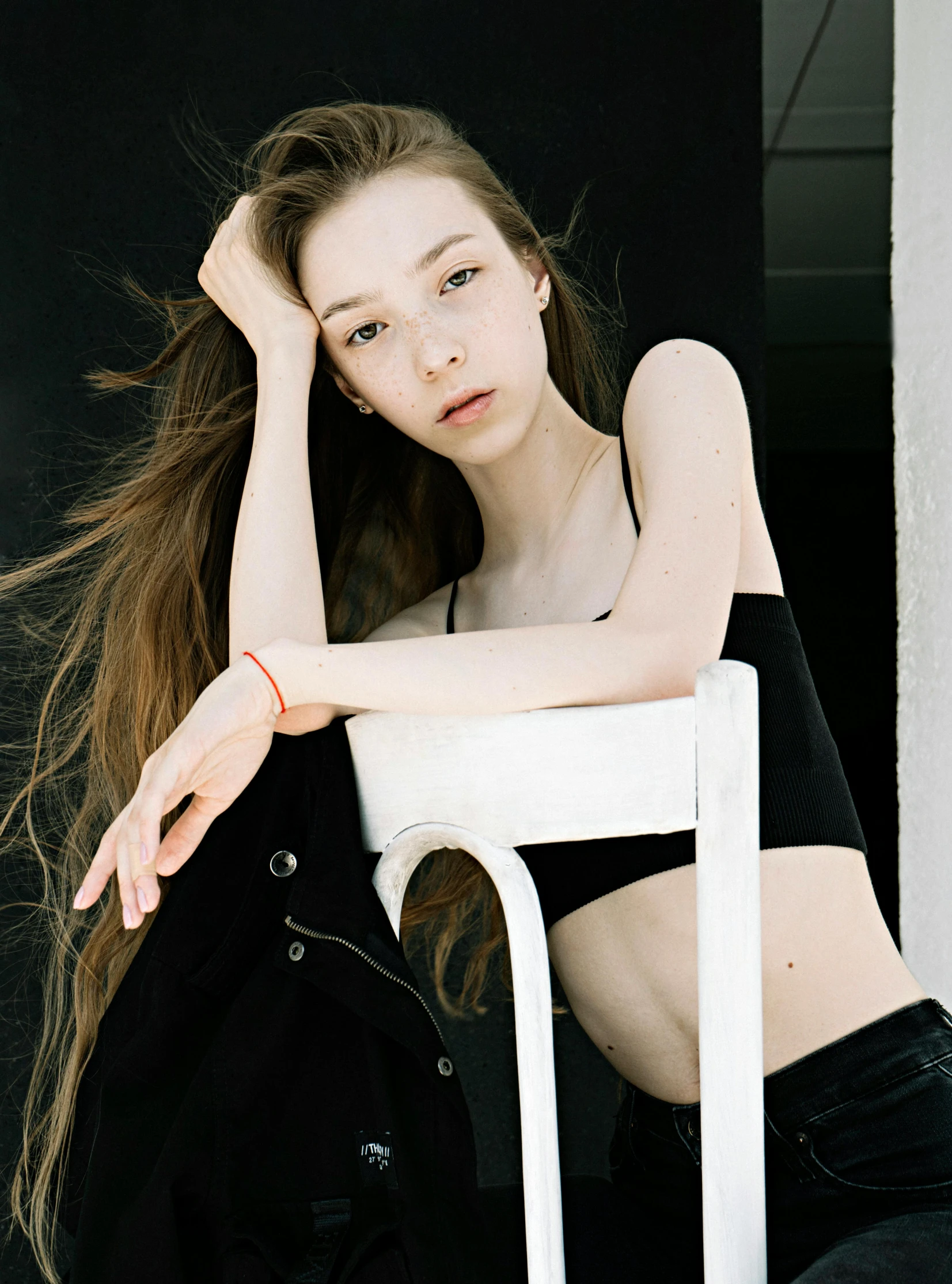 a woman sitting on top of a white chair, inspired by Elsa Bleda, unsplash, aestheticism, wearing a black cropped tank top, very very very pale skin, 🤤 girl portrait, ulzzang