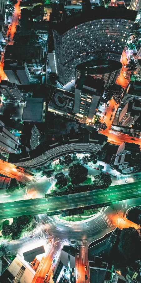 an aerial view of a city at night, digital art, by Adam Marczyński, trending on unsplash, glowing street signs, bird\'s eye view, ilustration, high angle close up shot