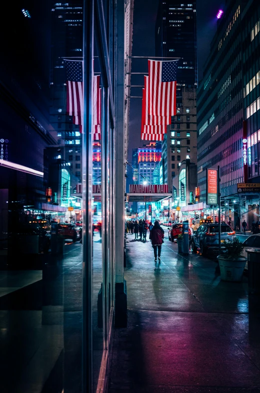 people walking down a city street at night, by Emanuel Witz, unsplash contest winner, pixel art, stars and stripes, time square, red and blue reflections, view from the streets