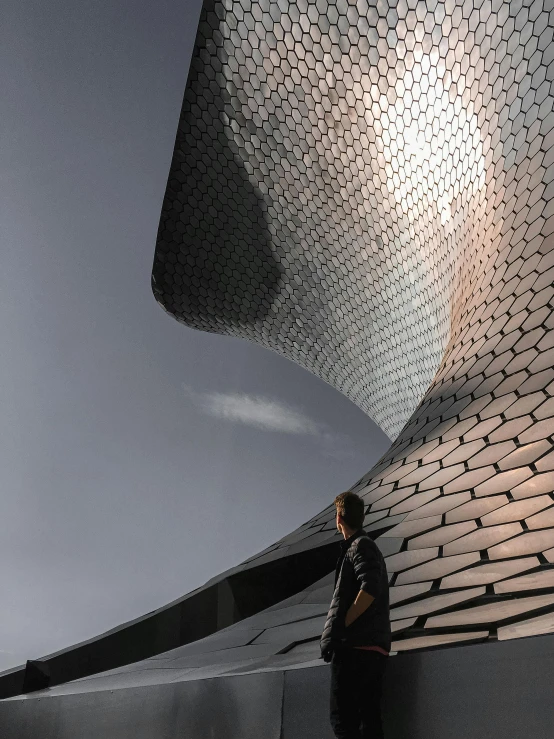 a man standing in front of a building, inspired by Zha Shibiao, pexels contest winner, mexico city, profile image, smooth scales, ray tracing on