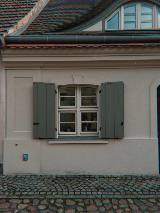 a house with shutters open on a cobblestone street, a colorized photo, inspired by Mihály Munkácsy, hyperrealism, nvidia raytracing demo), front facing!!, house windows, window ( city )