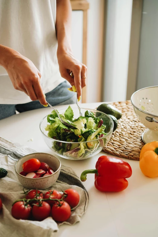 a person preparing a salad in a kitchen, pexels, process art, white bg, delightful surroundings, tabletop, splento