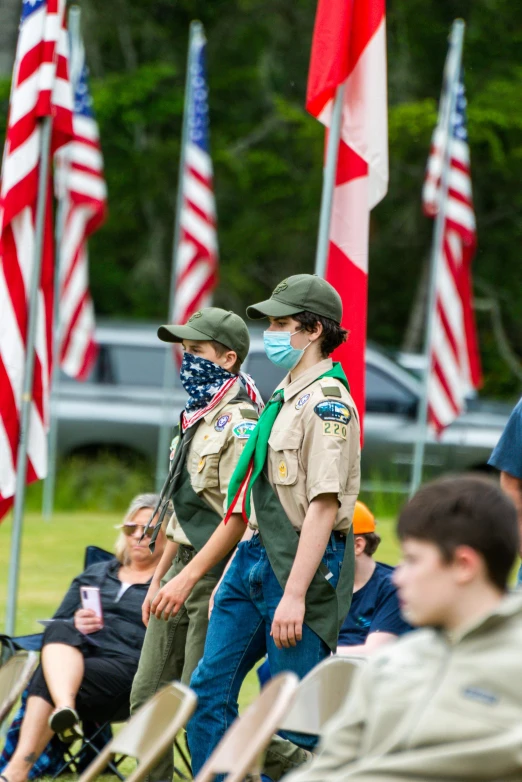 a group of scouts standing next to each other, by Greg Spalenka, symbolism, american flags, wearing facemask and sunglasses, slide show, alabama