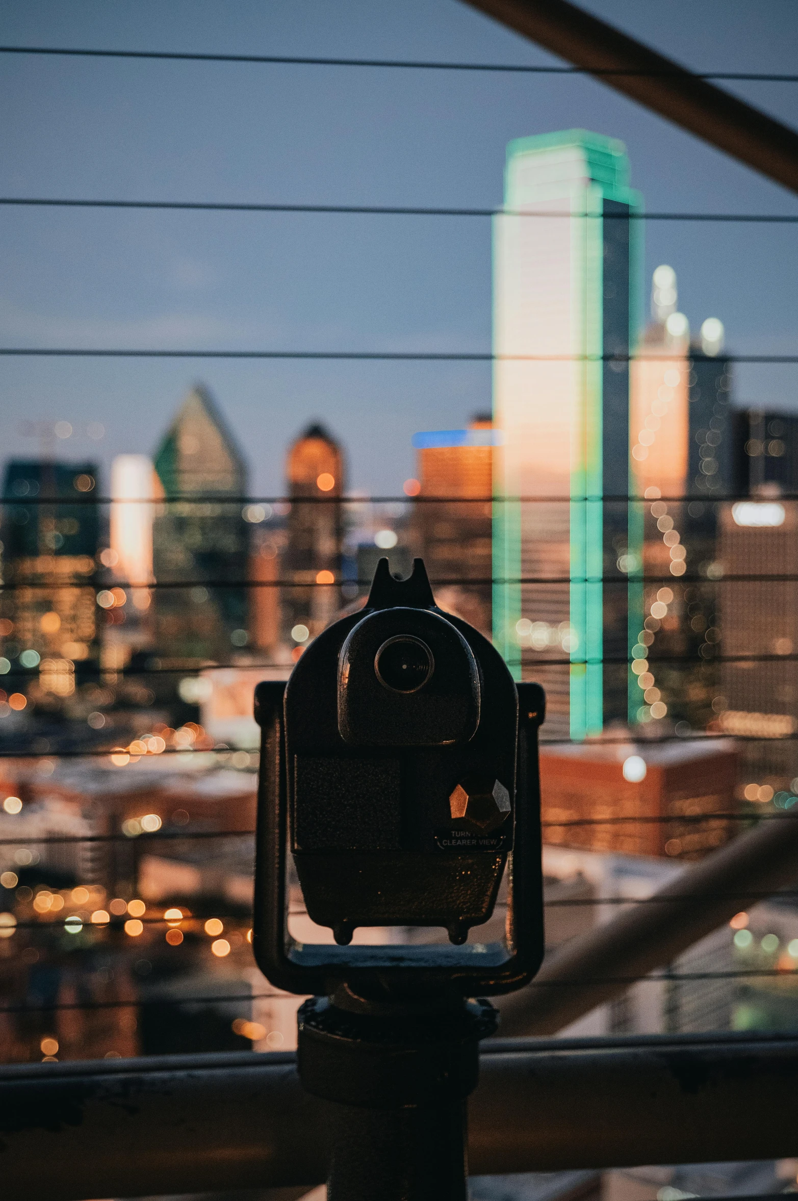 a pair of binoculars overlooking a city at night, by Carey Morris, pexels contest winner, vsco, towering over the camera, real estate photography, focus on full - body