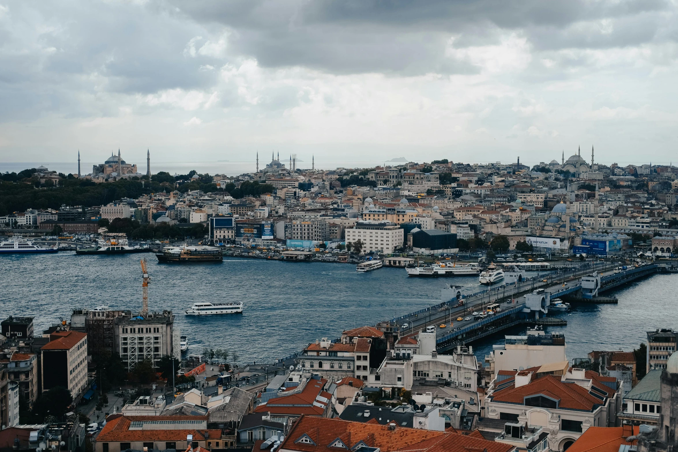 a large body of water next to a city, a colorized photo, pexels contest winner, hurufiyya, turkish and russian, grey, slide show, unsplash 4k