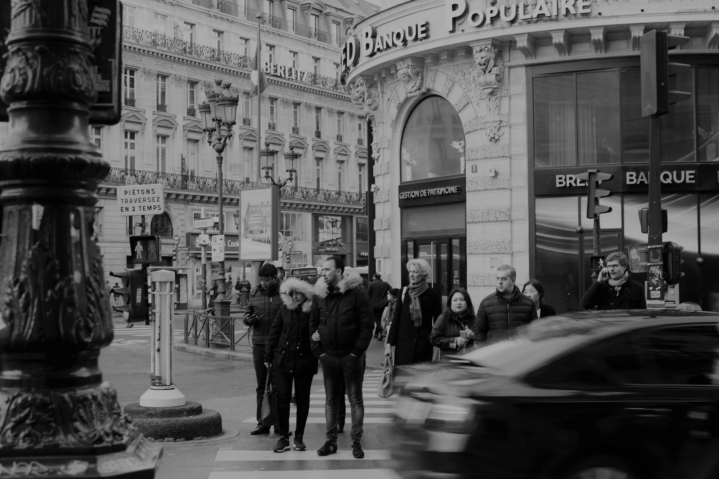 a black and white photo of people walking down a street, a black and white photo, by Raphaël Collin, pexels contest winner, standing on street corner, paris background, low quality footage, square