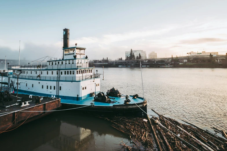 a large boat sitting on top of a body of water, a photo, by Morgan Russell, unsplash contest winner, portland oregon, thames river, plows, southern slav features