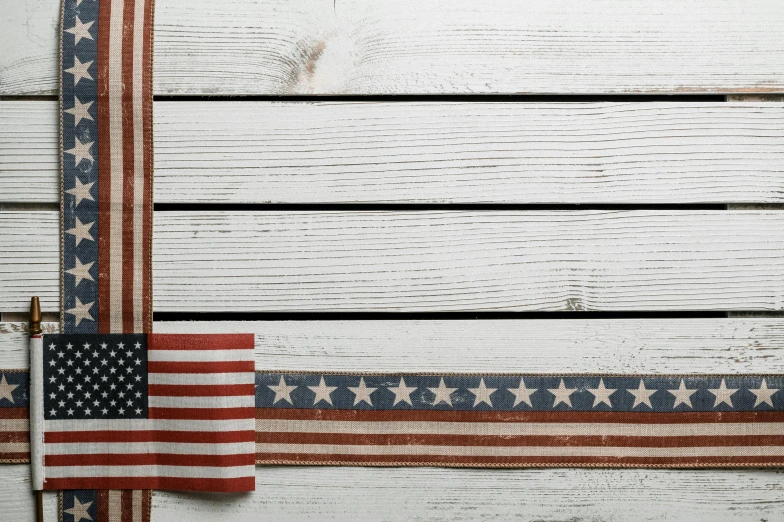 an american flag hanging on the side of a wooden wall, an album cover, unsplash, ribbon, white, white plank siding, rectangular