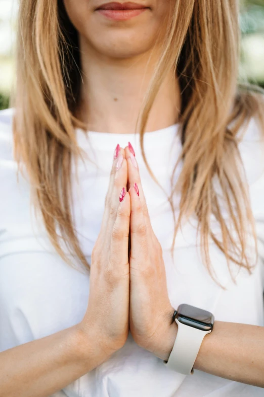 a woman with her hands folded in prayer, trending on pexels, yoga, a girl with blonde hair, white, professional photo