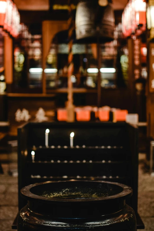 a bowl of food sitting on top of a table, embers, iconostasis in the bar, moody vibe, grill