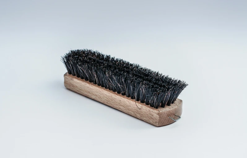 a close up of a brush on a white surface, a stipple, hurufiyya, product view, bog oak, thumbnail, black chalk