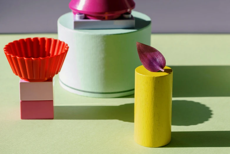 a couple of vases sitting on top of a table, an abstract sculpture, new objectivity, colourful cupcake, papercraft, full product shot, lily petals